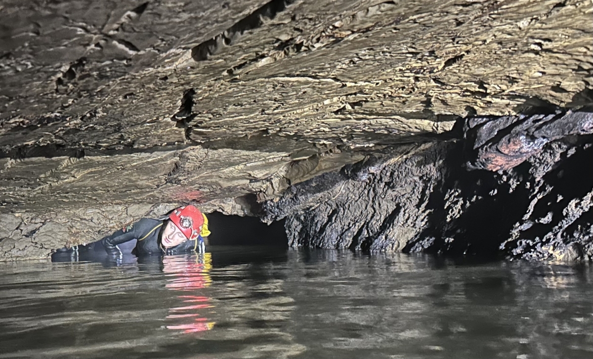 A member of the survey team explore Ma Dom cave. (Photo: British Cave Research Association &amp; other members of the survey team)