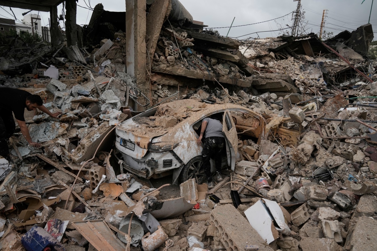 A man inspects his car damaged in a previous Israeli airstrike during a ceasefire between Hezbollah and Israel in the Hosh neighborhood of Tyre, southern Lebanon, on Sunday, April 19, 2026. Photo: AP/Bilal Hussein