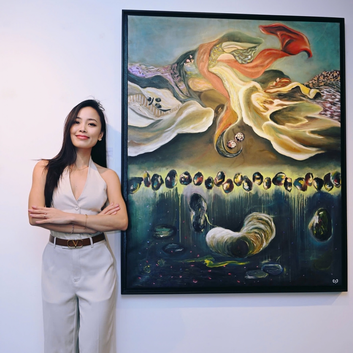 In photo: Van Guillemin and her painting "Interior Root". Van said the organic forms that appear in most of her photos simply represent feelings made visible. She does not have a name for it and those who come to admire the paintings may interpret the shapes in any ways they wish. (Photo courtesy of Van Guillemin)