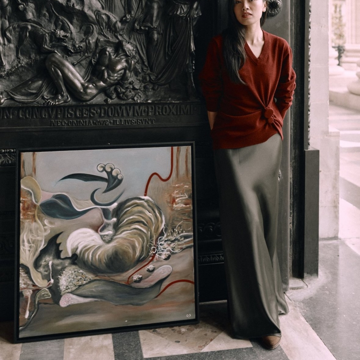 In photo: Van Guillemin poses next to one of her painting "The First Beat" in France. (Photo courtesy of Van Guillemin)