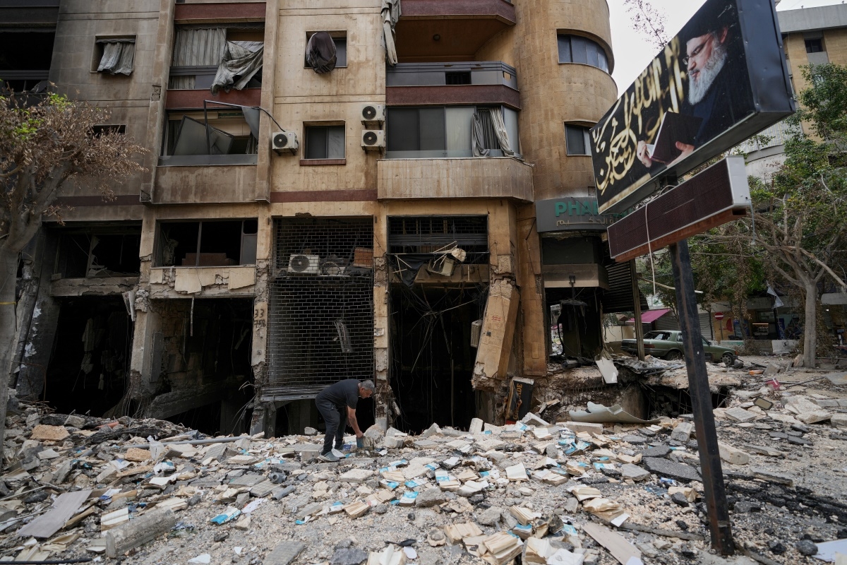 A man searches through the rubble of a destroyed building, following a ceasefire between Hezbollah and Israel, in Dahiyeh, Beirut's southern suburbs, Lebanon, Monday, April 20, 2026. (Photo: AP/Hussein Malla)