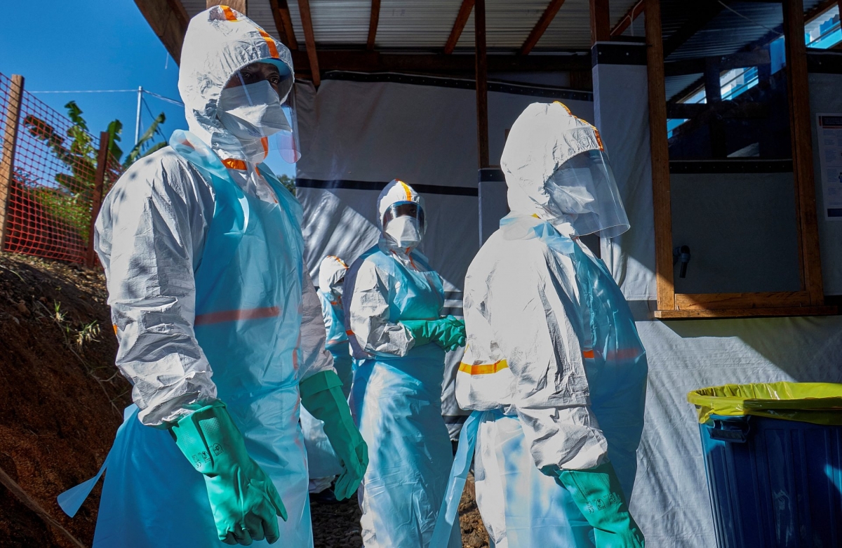 Medical personnel wearing protective gear disinfect equipment while treating an Ebola patient in Ituri, Democratic Republic of the Congo. (Photo: REUTERS/Gradel Muyisa Mumbere)