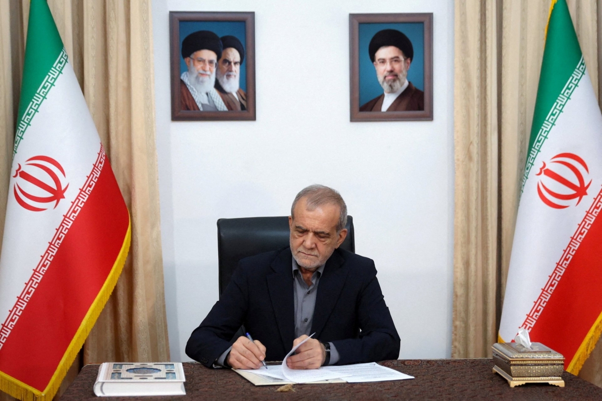 Iranian President Masoud Pezeshkian signs the memorandum of understanding with the United States in Tehran, Iran, on June 18, 2026. Photo: Website of the Iranian Presidential Palace/WANA via REUTERS.