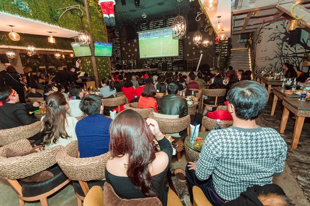 Customers gather at Trixie Cafe &amp; Lounge to watch football matches on a large screen. (Photo: Trixie)