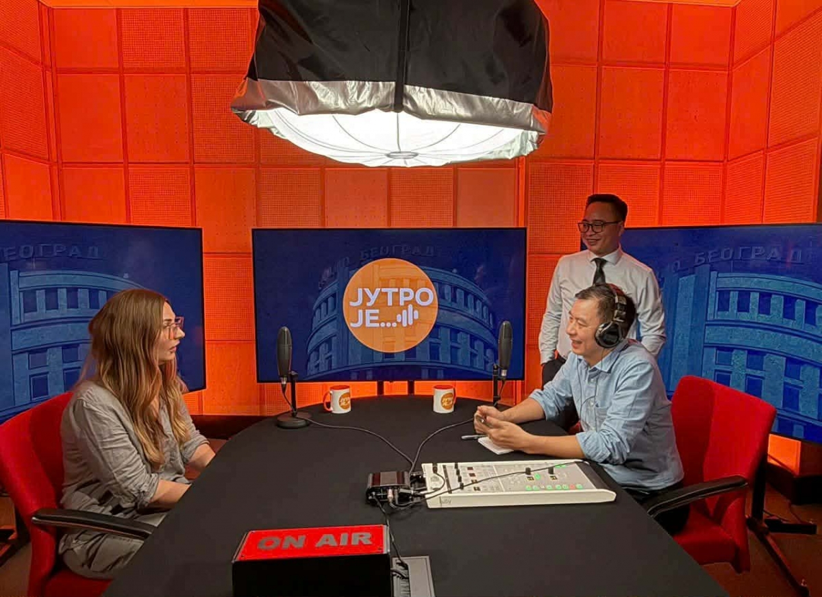Members of the VOV delegation explore the podcast studio at Radio Belgrade.