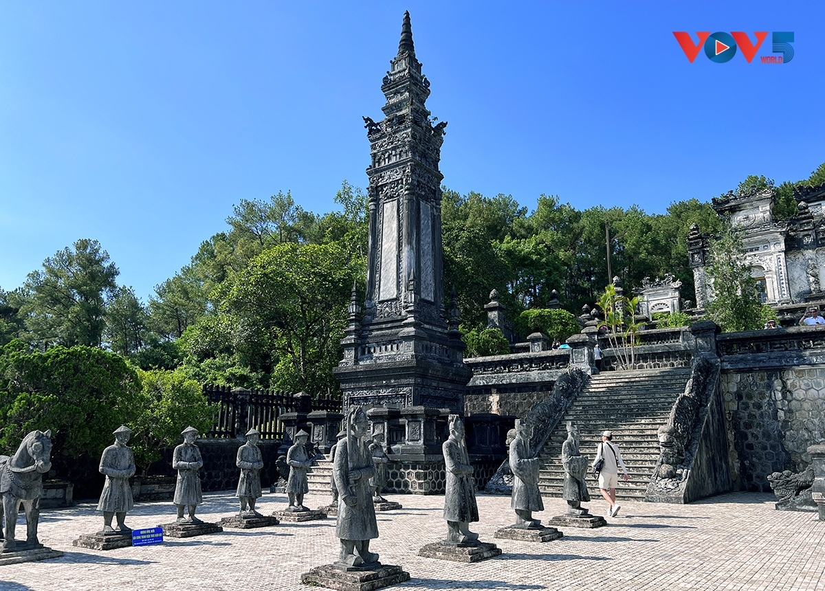 Two rows of life-sized stone statues of mandarins, soldiers, elephants, and horses reflect the Nguyen Dynasty's refined craftsmanship and royal traditions.
