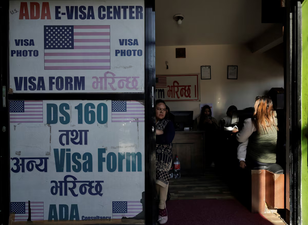 People wait to fill out US visa application forms at a visa consultancy office in Kathmandu, Nepal. (Photo: REUTERS/Navesh Chitrakar)