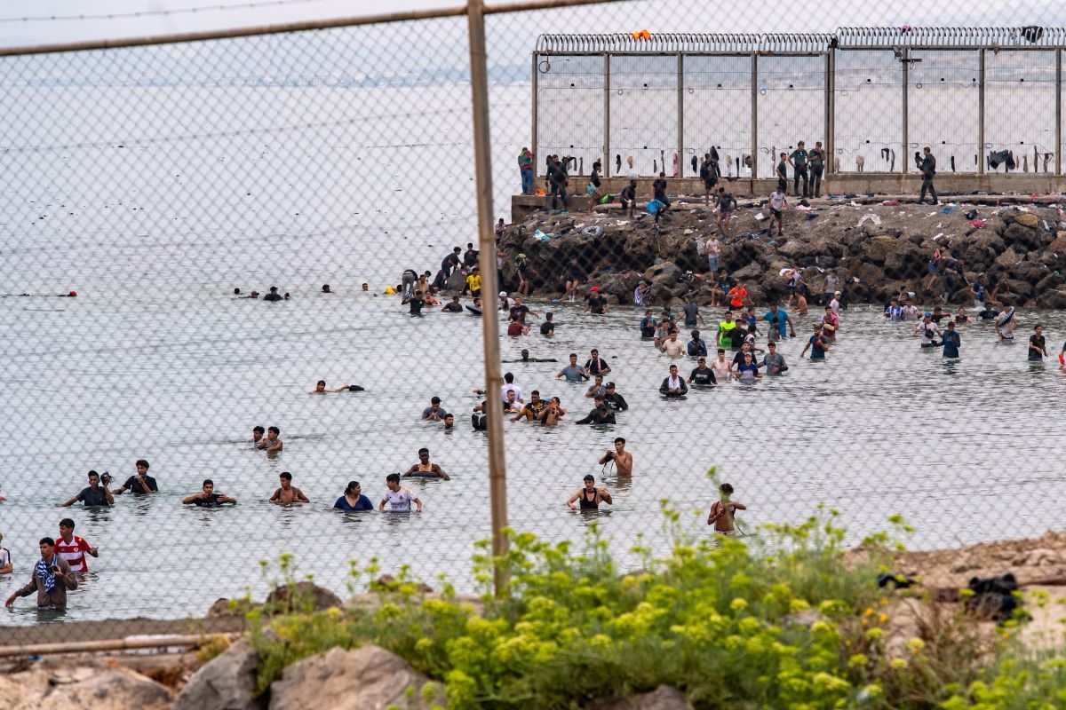 Migrants try to cross from Morocco into the Spanish enclave of Ceuta, Friday, July 31, 2026. Photo: AP/Antonio Sempere 