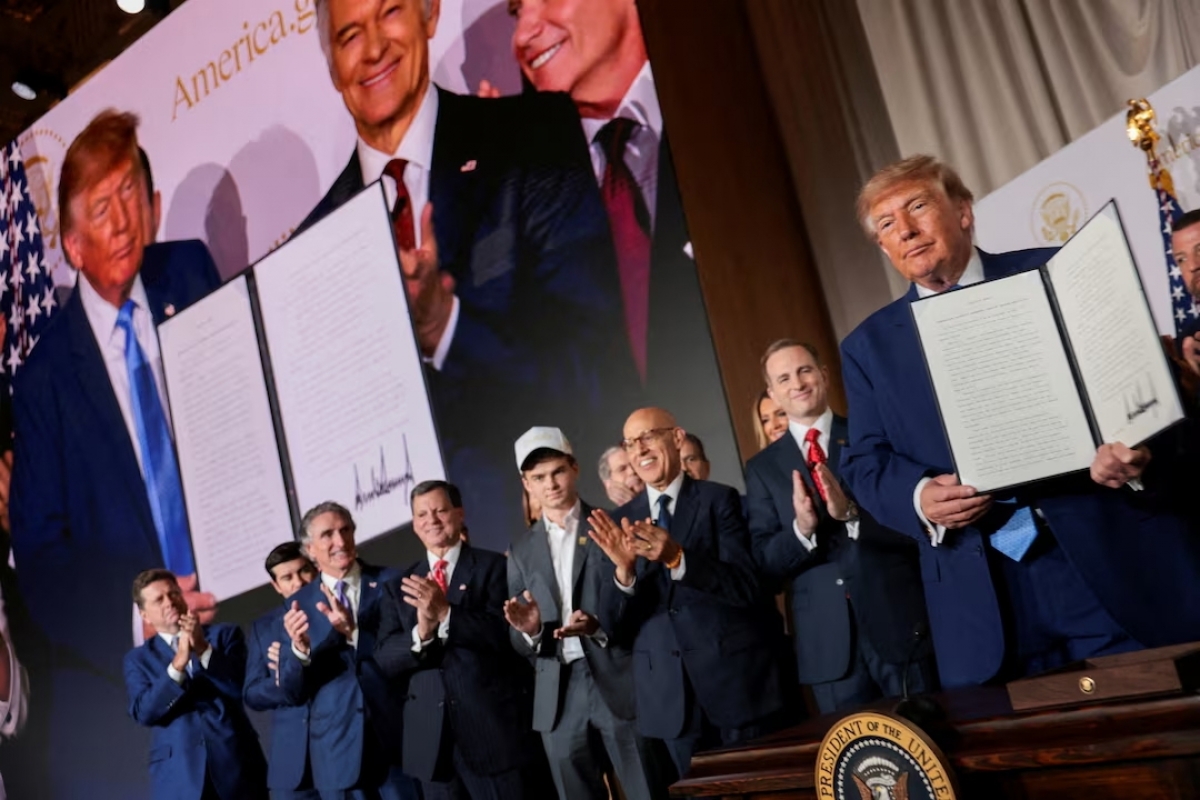 US President Donald Trump shows a signed Executive Order related to a new AI-powered government website, America.gov, during the National Design Studio launch event of the website at the Mellon Auditorium in Washington, DC, USA, September 29, 2026. (Photo: REUTERS)