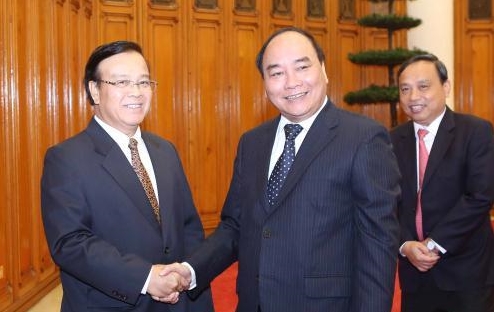 Нгуен Суан Фук принял делегацию Министерства планирования и инвестиций Лаоса