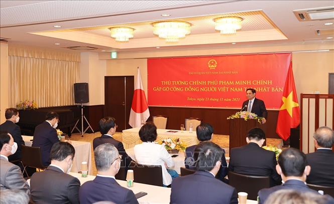 El primer ministro Pham Minh Chinh se reúne con compatriotas residentes en Japón
